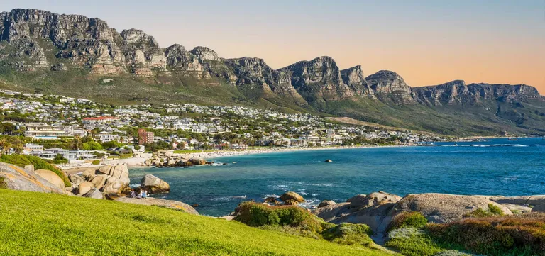 Clifton 4th Beach curving below the Twelve Apostles, white apartments stacked above the sand