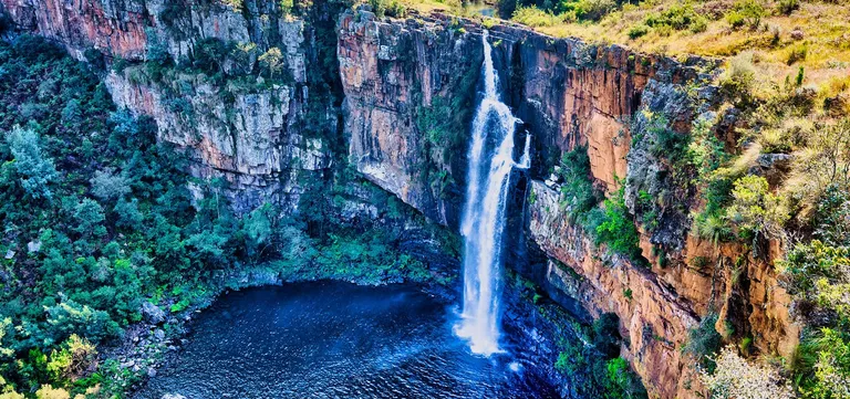 Berlin Falls dropping in its candle shape into a deep pool on the Panorama Route, South Africa