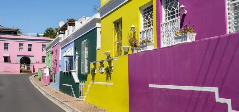 Brightly coloured houses along a steep street in Bo-Kaap, Cape Town