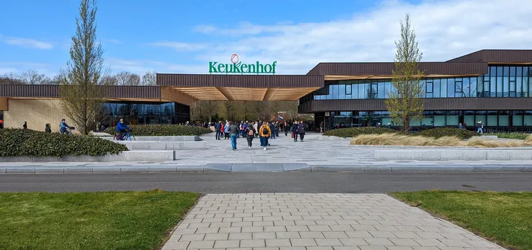 Visitors arriving at the modern main entrance building at Keukenhof, Lisse, Netherlands