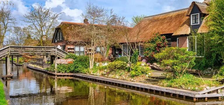 Museum De Oude Aarde on the canal in Giethoorn, reached by its own bridge