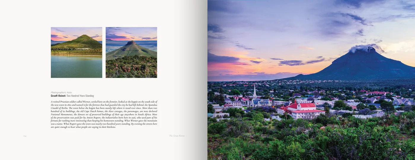 Two koppie frames and the note face a town at dusk beneath a flat-topped peak trailing cloud